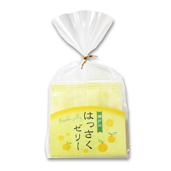 A clear plastic bag containing individually wrapped 瀬戸内はっさくゼリー (hassaku fruit jellies) with a yellow front label.