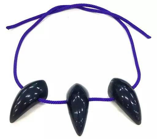Three dark plastic leaf-shaped beads strung on a purple cord as a necklace.