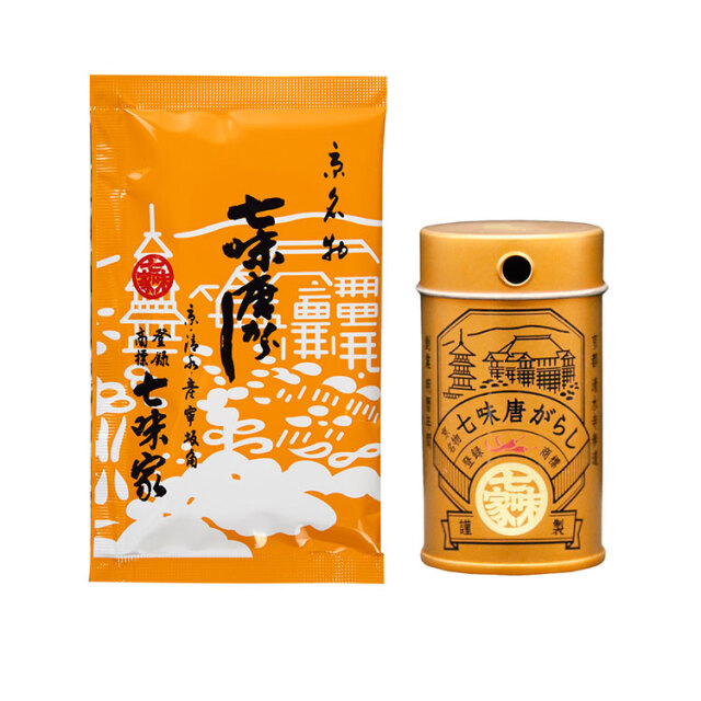 An orange 15g shichimi togarashi sachet displayed next to a matching orange spice tin with Japanese labeling.