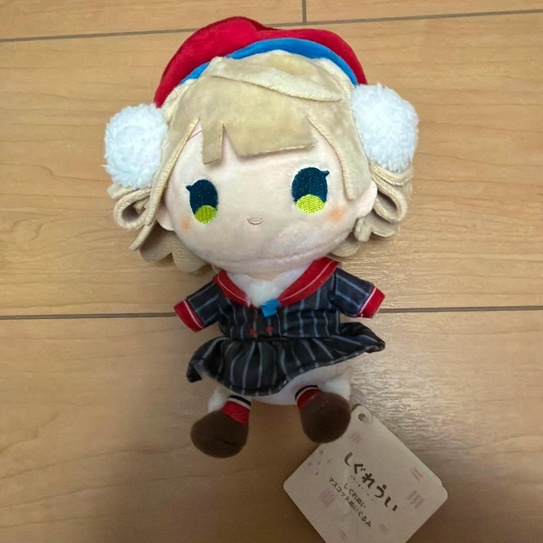 Front view of the しぐれうい mascot plush showing embroidered face, red beret, striped dress, and attached tag.