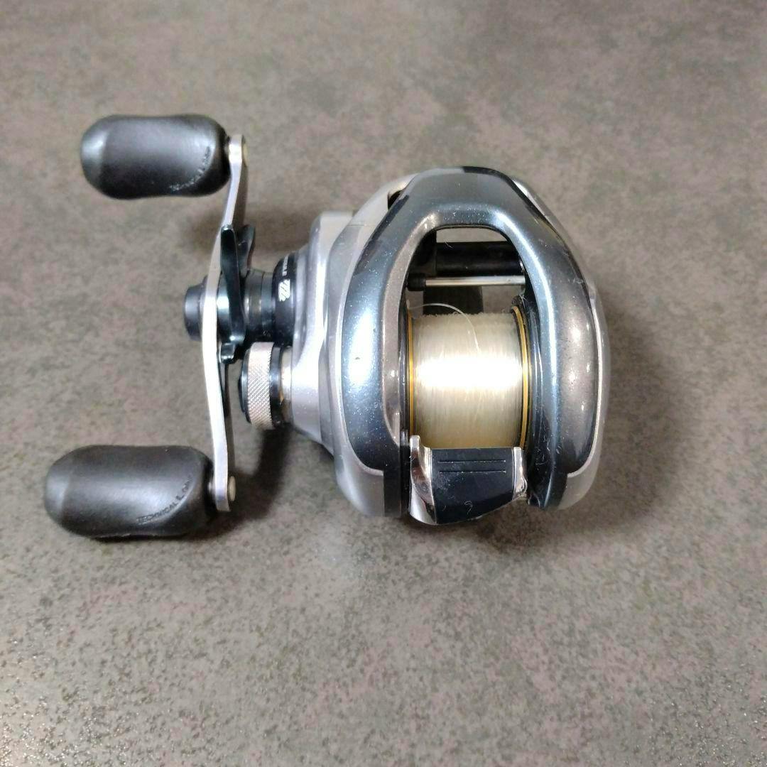 Front view of the Shimano Metanium baitcasting reel showing the spool wound with line and the dual paddle handle.