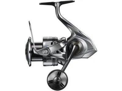Side view of the Shimano 24 Twin Power C5000XG spinning fishing reel on a white background.
