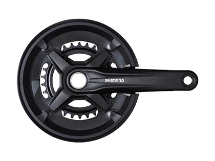 Front view of a Shimano chainwheel and crankset with integrated chain guard and right-side crank arm.