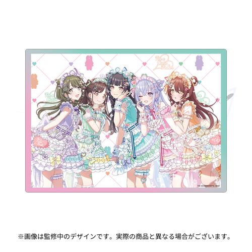 Rectangular polyester playmat showing five anime-style girls in pastel frilly outfits on a patterned background.