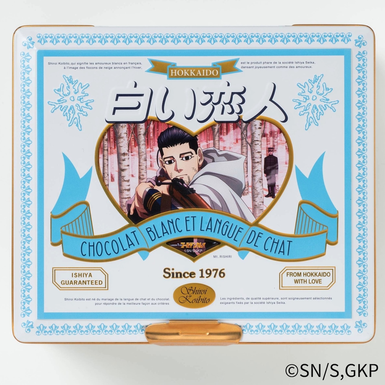 Packed tin of 白い恋人 cookies with blue-white decorative packaging and a heart-shaped window featuring an illustrated character.