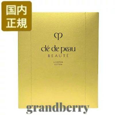 Gold box packaging of Clé de Peau Beauté Le Coton cotton pads showing the brand logo and a Japanese authenticity badge.