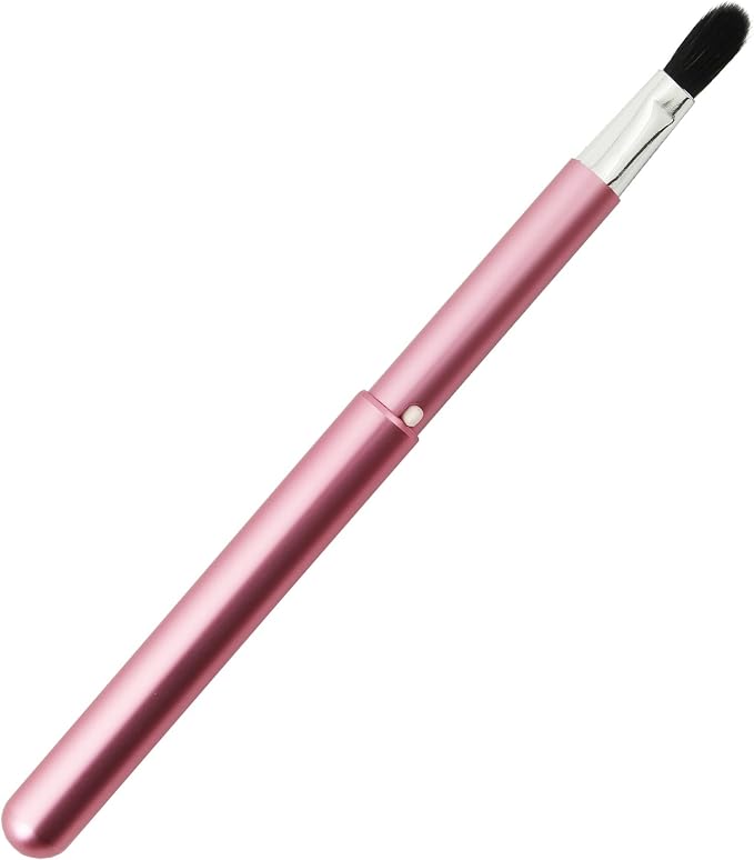 A pink slide-style (retractable) eyeshadow brush with black bristles and a silver ferrule.