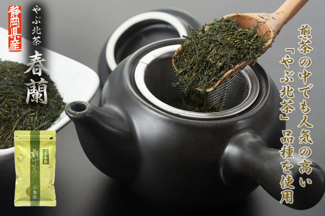 Loose green tea leaves being scooped into a teapot infuser, with the product's green packaging shown in the corner.