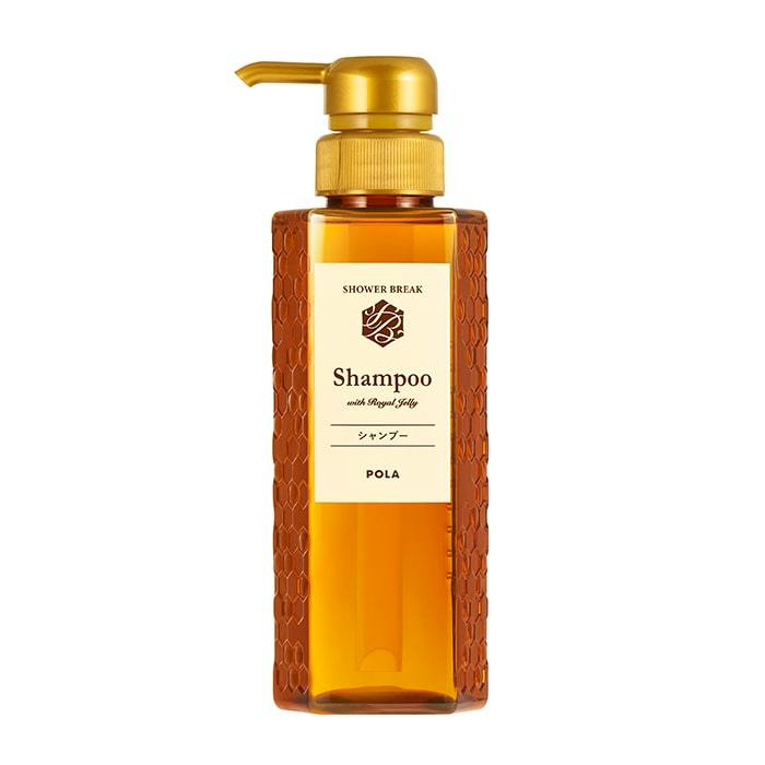 Front view of the シャワーブレイク シャンプー amber pump bottle with a cream label and gold pump.