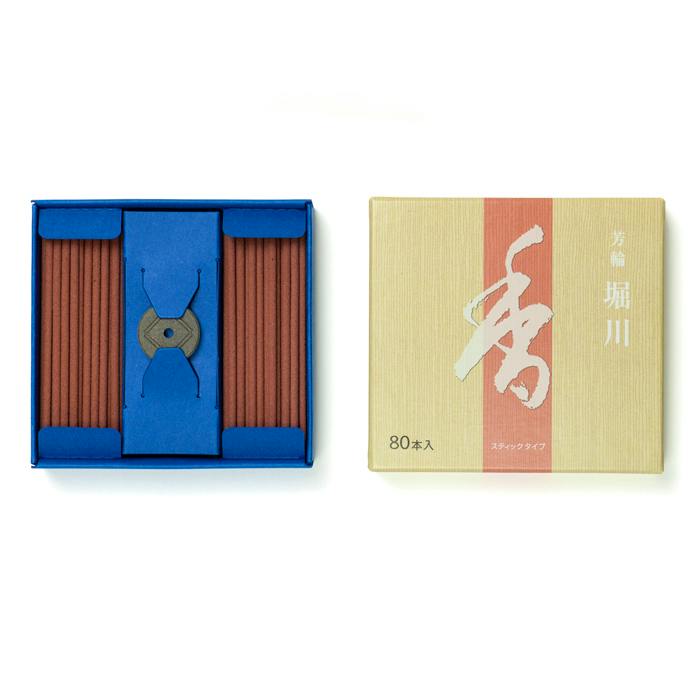 Open box of incense sticks showing two bundles of brown sticks in a blue tray with the beige outer box labeled 80本入 beside it.