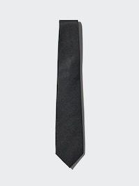 A black silk necktie laid flat on a light gray background.