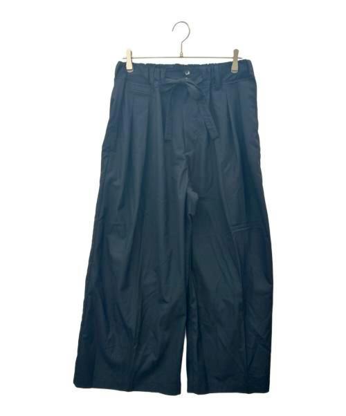 Front view of Sillage wide women's pants with a tie waistband hanging on a hanger against a white background.