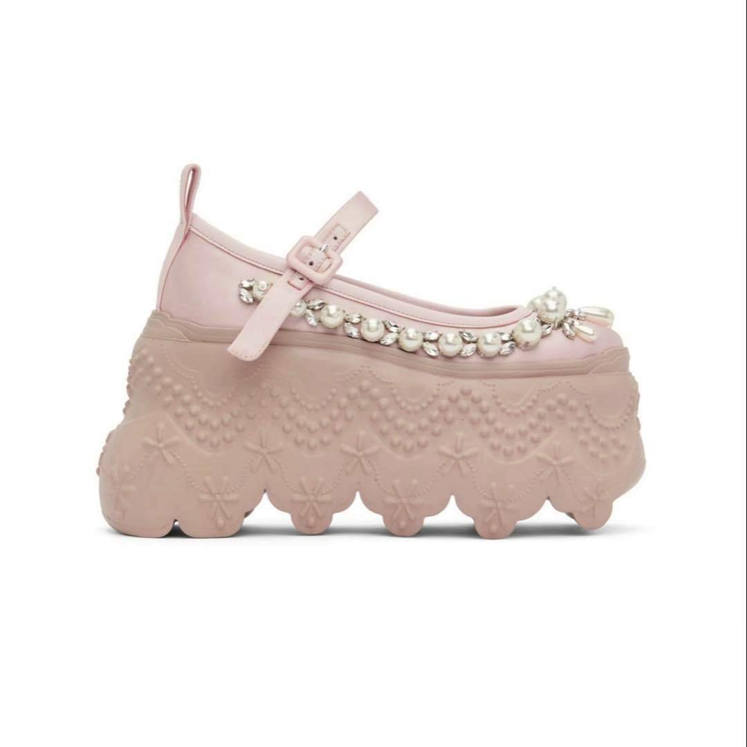 Side view of a pink Simone Rocha leather ballet shoe with pearl embellishments and a scalloped platform sole on a white background.