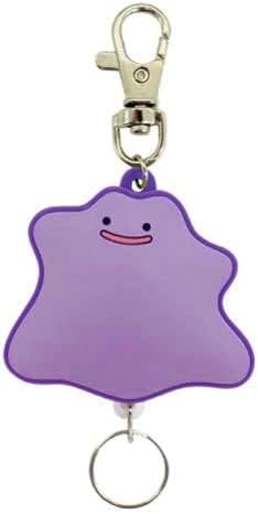 Purple Metamon (Ditto) rubber keychain with a metal clip and a key ring.
