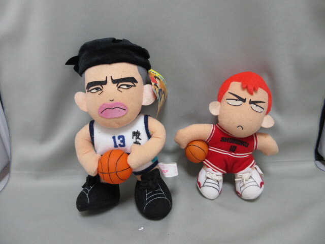 Two plush dolls from Slam Dunk (Sakuragi Hanamichi and Uozumi Jun) sitting and holding basketballs.