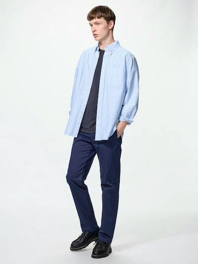 Male model wearing the slim straight men's jeans shown full-length.