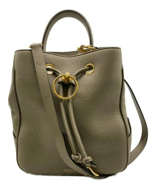 Front view of the Small Hamstead Classic cow leather bag with top handle, drawstring closure, and shoulder strap.