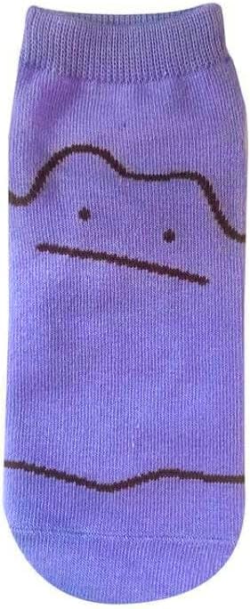 Single purple children's cotton sock with a simple Metamon (Ditto) face design printed on it.