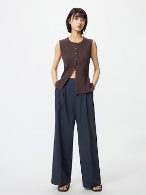 Full-length photo of a model wearing the women's wide straight pants (polyester).