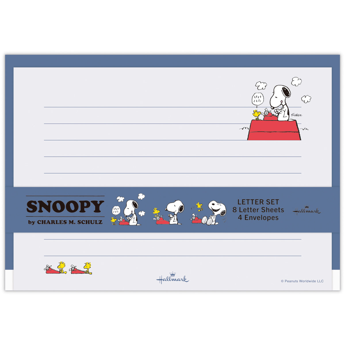 Flat-lay image of a Snoopy letter set showing lined stationery sheets and a matching envelope decorated with Snoopy and Woodstock and a red typewriter motif.