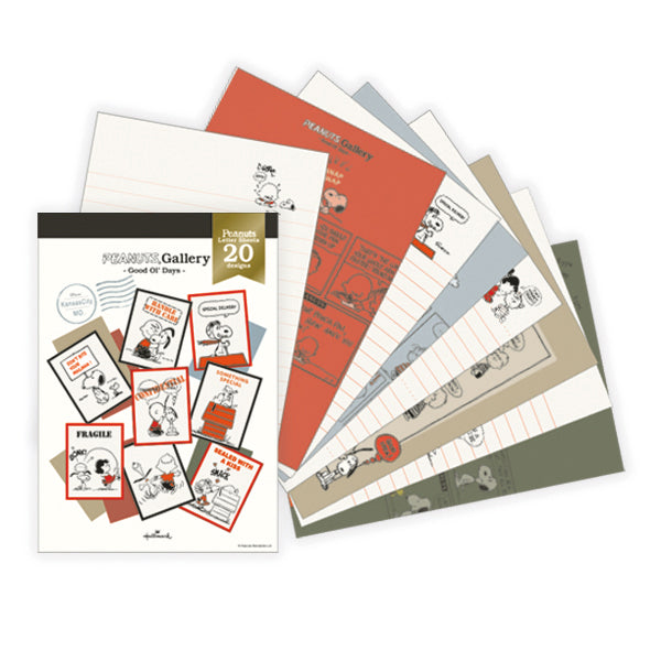 Fanned Snoopy-themed letter pad sheets with a cover showing multiple design samples.