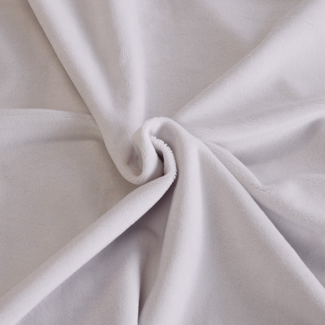 A swirled piece of short-pile polyester fabric showing its texture and drape.