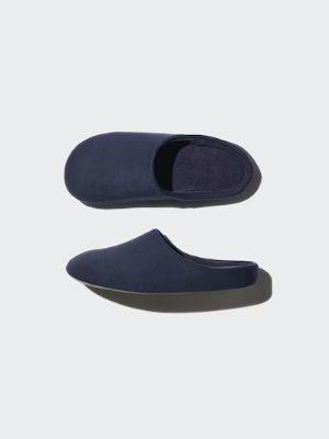 Two navy slip-on slippers, one shown from above and one from the side, on a light background.