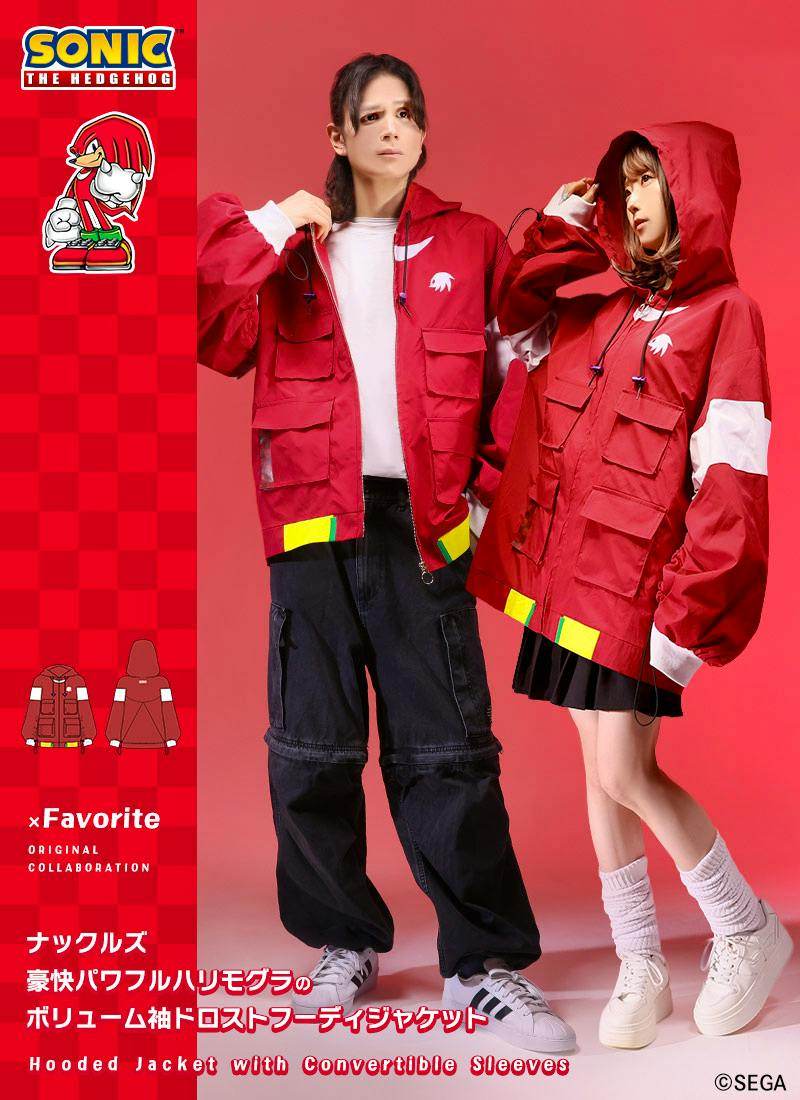 Two models wearing red "Knuckles" collaboration hooded jackets with voluminous sleeves, front flap pockets, and white/yellow accents, posed against a red background.