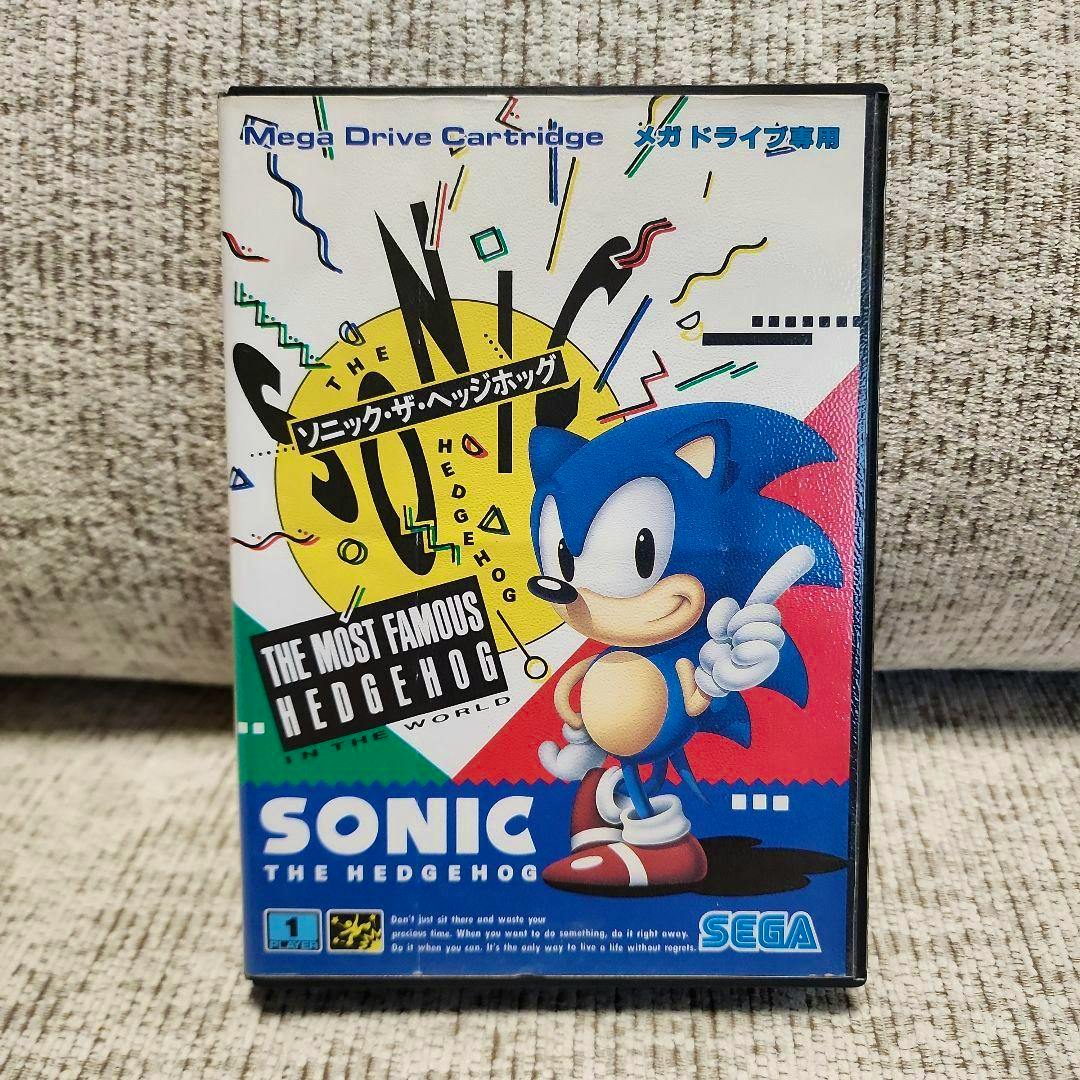 Front cover of the Sonic the Hedgehog Mega Drive game case showing Sonic artwork, title text, and the SEGA logo.