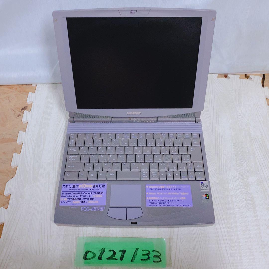Open Sony VAIO PCG-861/BP laptop photographed from above, showing the screen, keyboard, touchpad, and stickers on the palm rest.