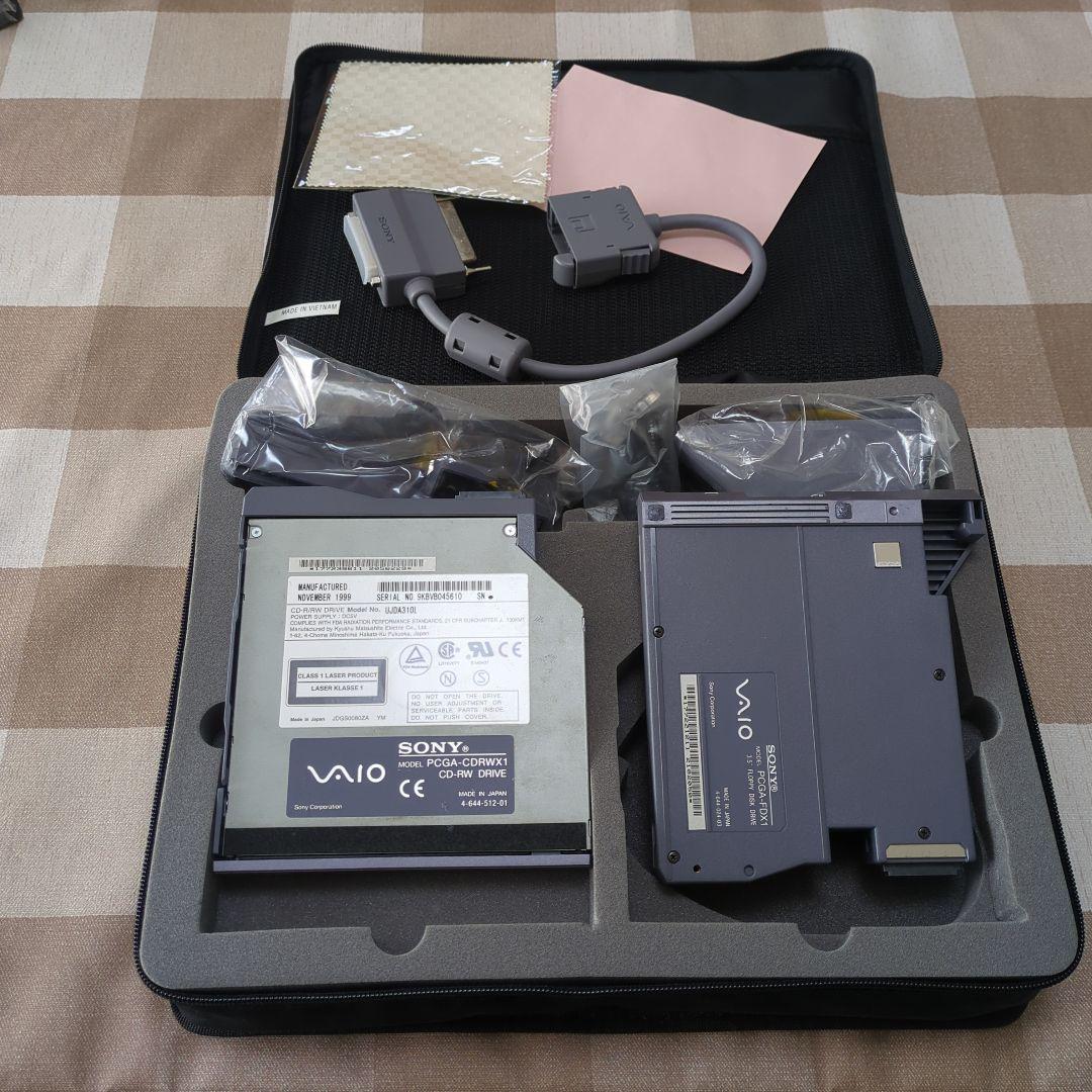 Open carrying case with two Sony VAIO PCGA-CDRW1 CD-RW drive units and connecting cables seated in a foam insert.
