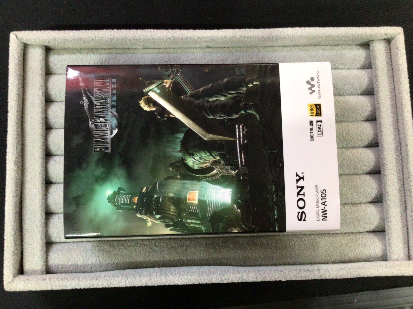 Boxed Sony WALKMAN NW-A105 FINAL FANTASY VII REMAKE edition packaging with cover art inside a foam tray.