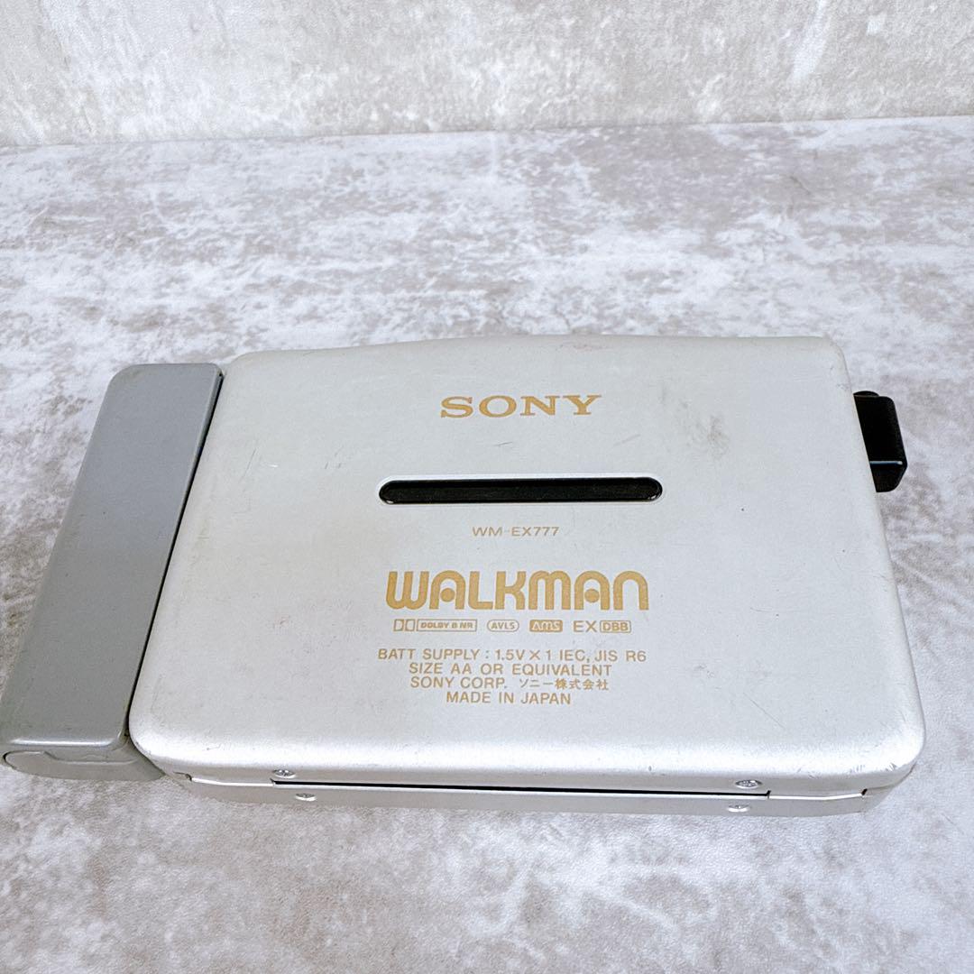Silver Sony WALKMAN WM-EX777 cassette player shown closed on a light background.