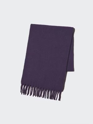 A folded dark purple acrylic scarf with fringe displayed on a plain light background.