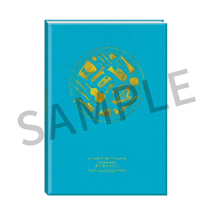 Front cover of the book showing a teal hardcover with gold instrument illustrations and a gray "SAMPLE" watermark.