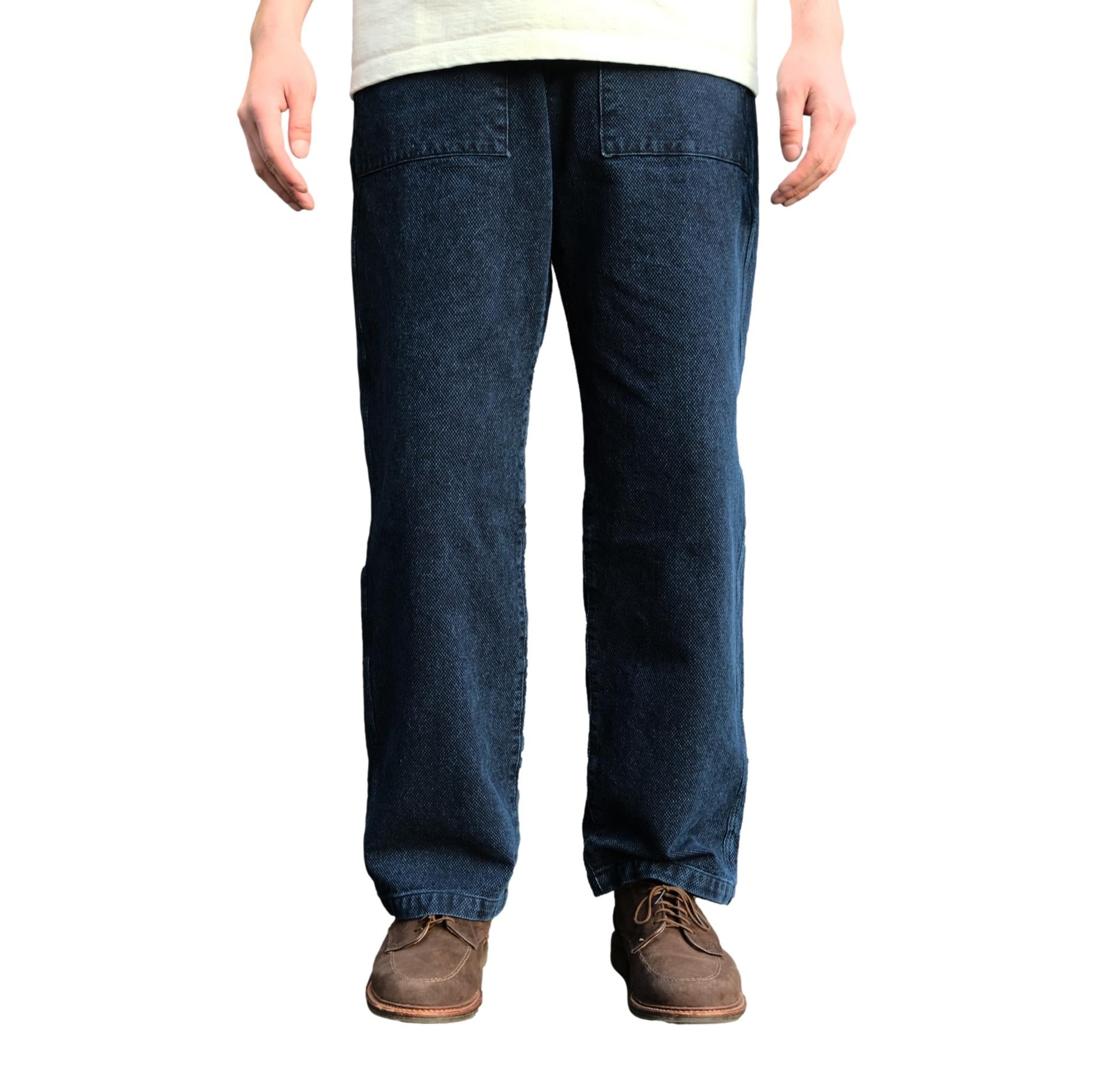 Front view of a model wearing the Soundman "Old Baker" Indigo Sashiko Baker Pants.
