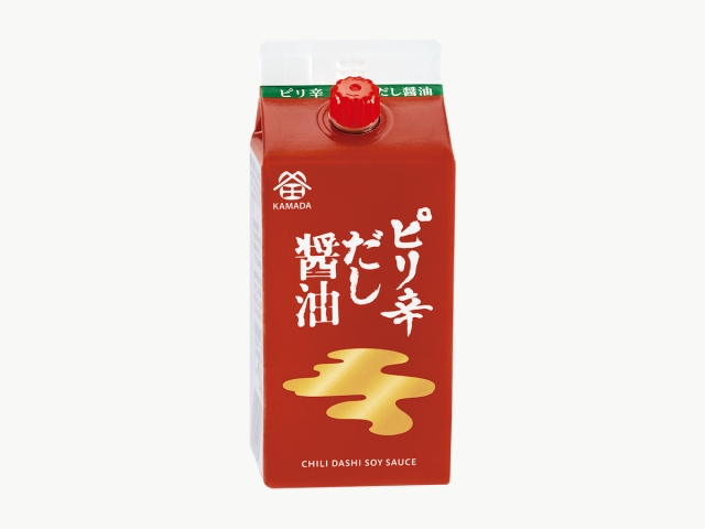 A red carton of ピリ辛だし醤油 (chili dashi soy sauce) with a red cap on a white background.