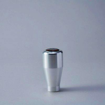 Silver SPOON car shift knob on a plain light-gray background.
