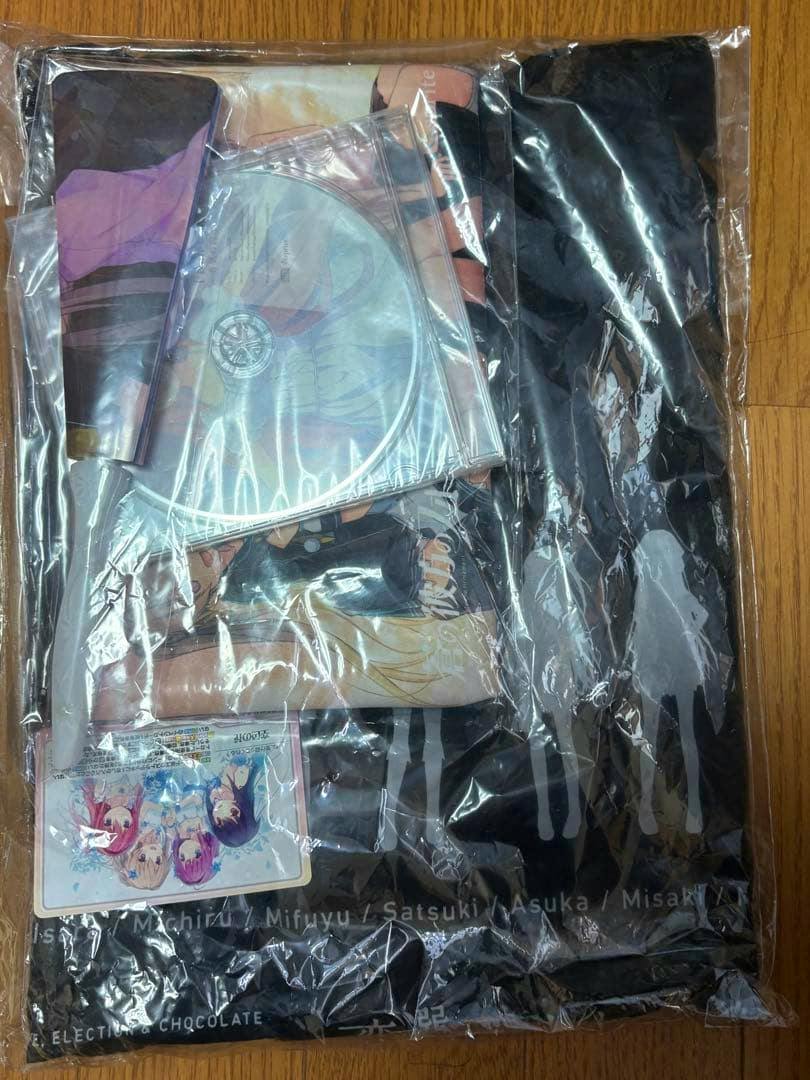 Photo of the sprite 夏祭り2018グッズセット items sealed in plastic packaging, showing a CD disc and accompanying fabric goods.