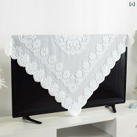 White lace square dust cover draped over a flat-screen television.