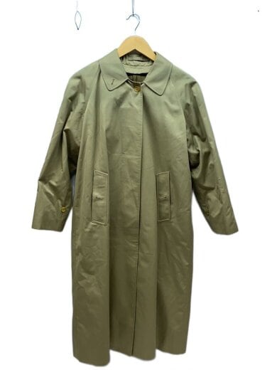 Front view of a beige men's cotton long coat with a pointed collar hanging on a wooden hanger.