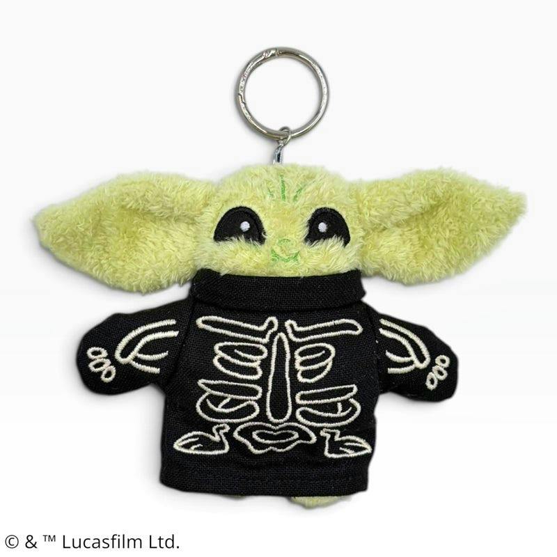 Front view of the Grogu fluffy mascot keychain wearing a black skeleton outfit with visible ears and a metal key ring.