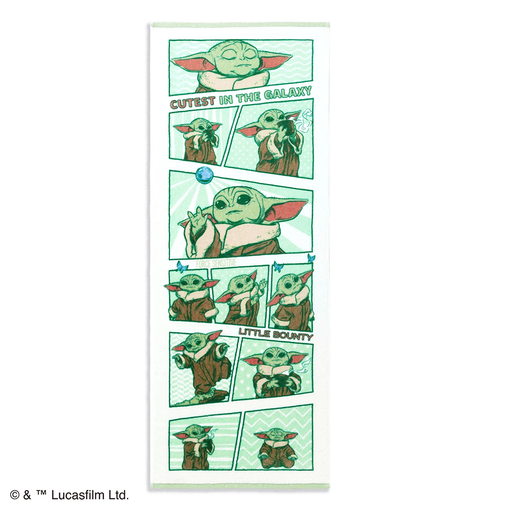 A STAR WARS face towel with multiple comic-style panels showing a small green alien character in various poses and printed text.