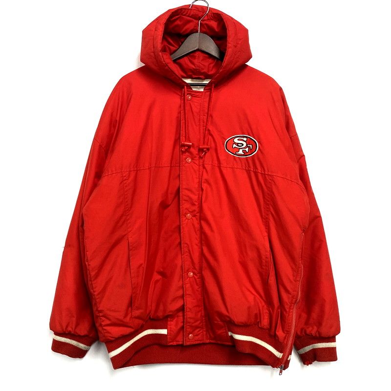 Red men's hooded polyester jacket with San Francisco 49ers "SF" chest logo hanging on a hanger.