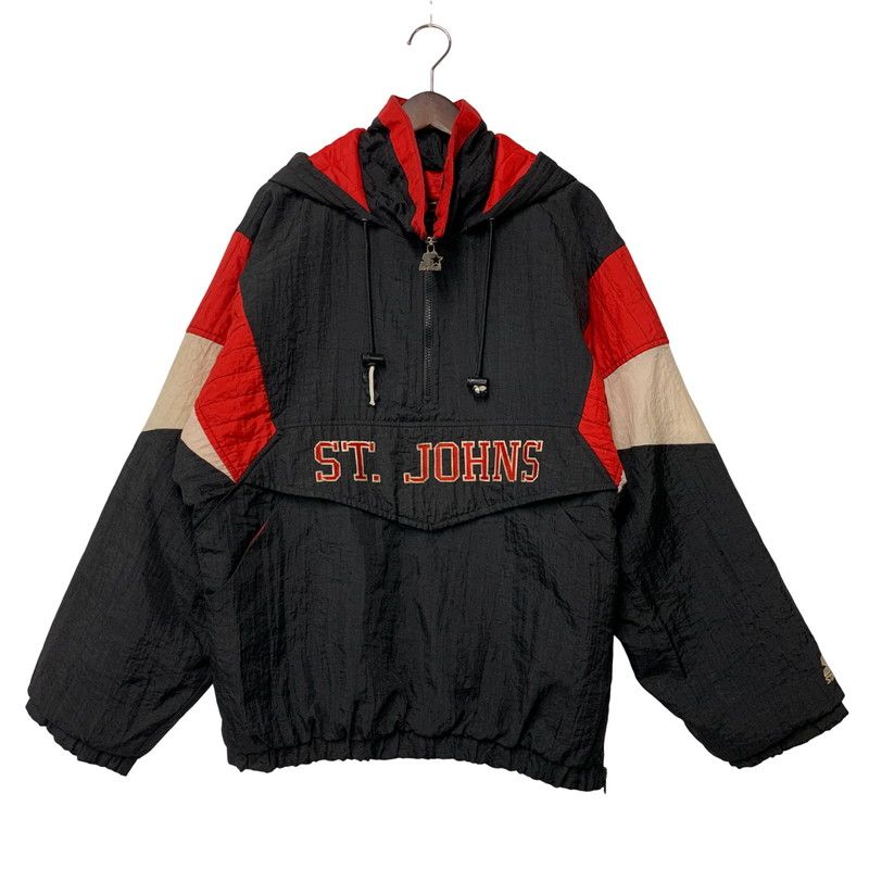 Men's half-zip nylon pullover jacket with ST. JOHNS embroidery, black with red and beige panels, shown on a hanger against a white background.