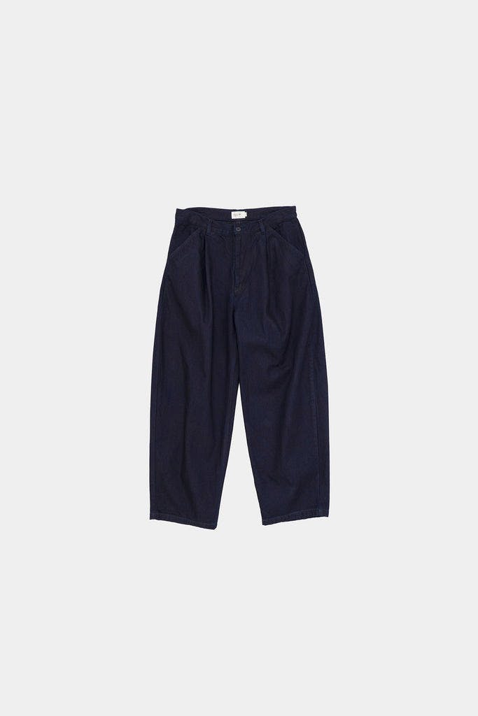 Flat-lay front view of STILL BY HAND men's denim pants (cotton) in dark indigo on a white background.
