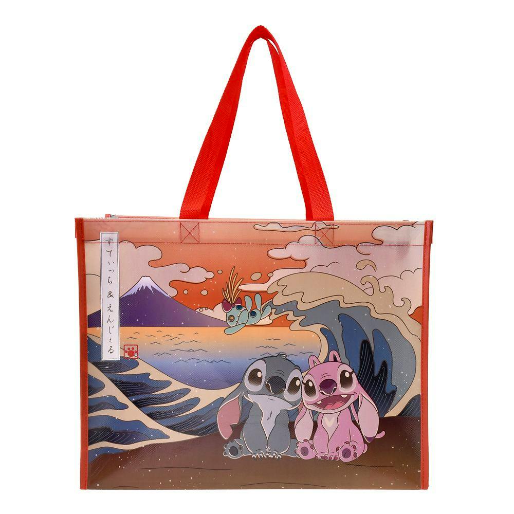 Front view of a reusable tote bag with red handles featuring an illustrated scene of Stitch, Angel, and Scrump.