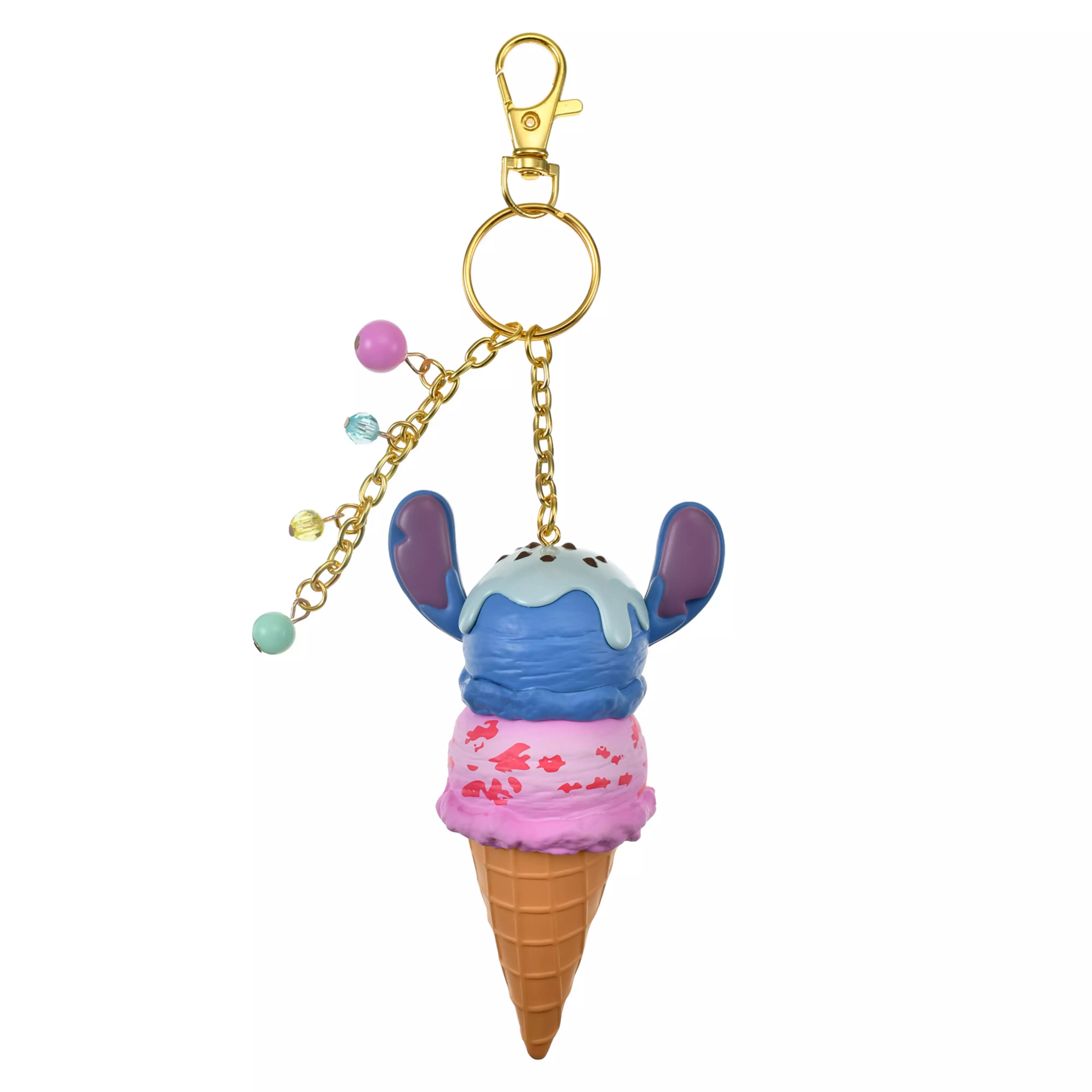 Keychain showing Stitch perched on a double-scoop ice cream cone with a gold-colored clasp and small beaded charms.