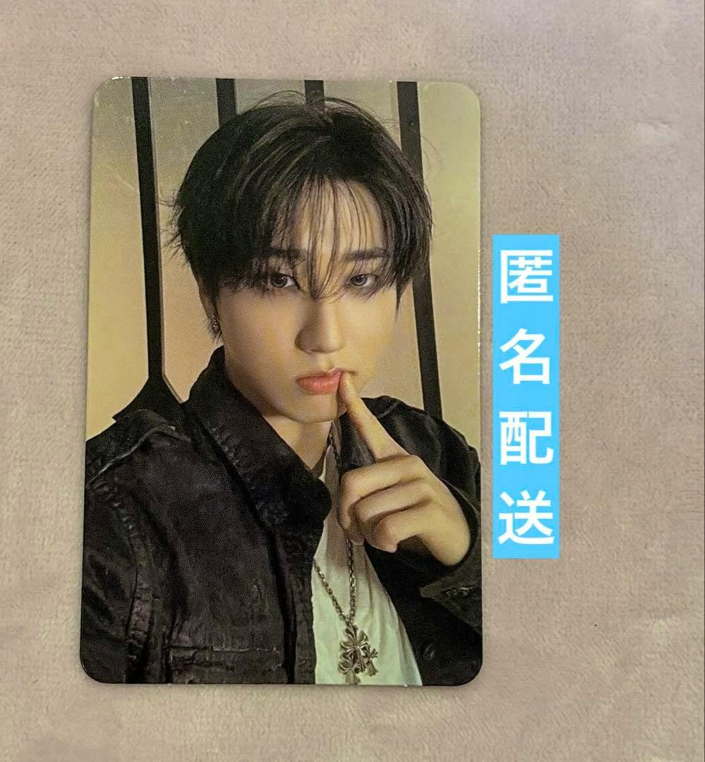 Front of the StrayKids EVIL SKZOO SPEAKER photocard showing a portrait of a band member posing with a finger to their lips.