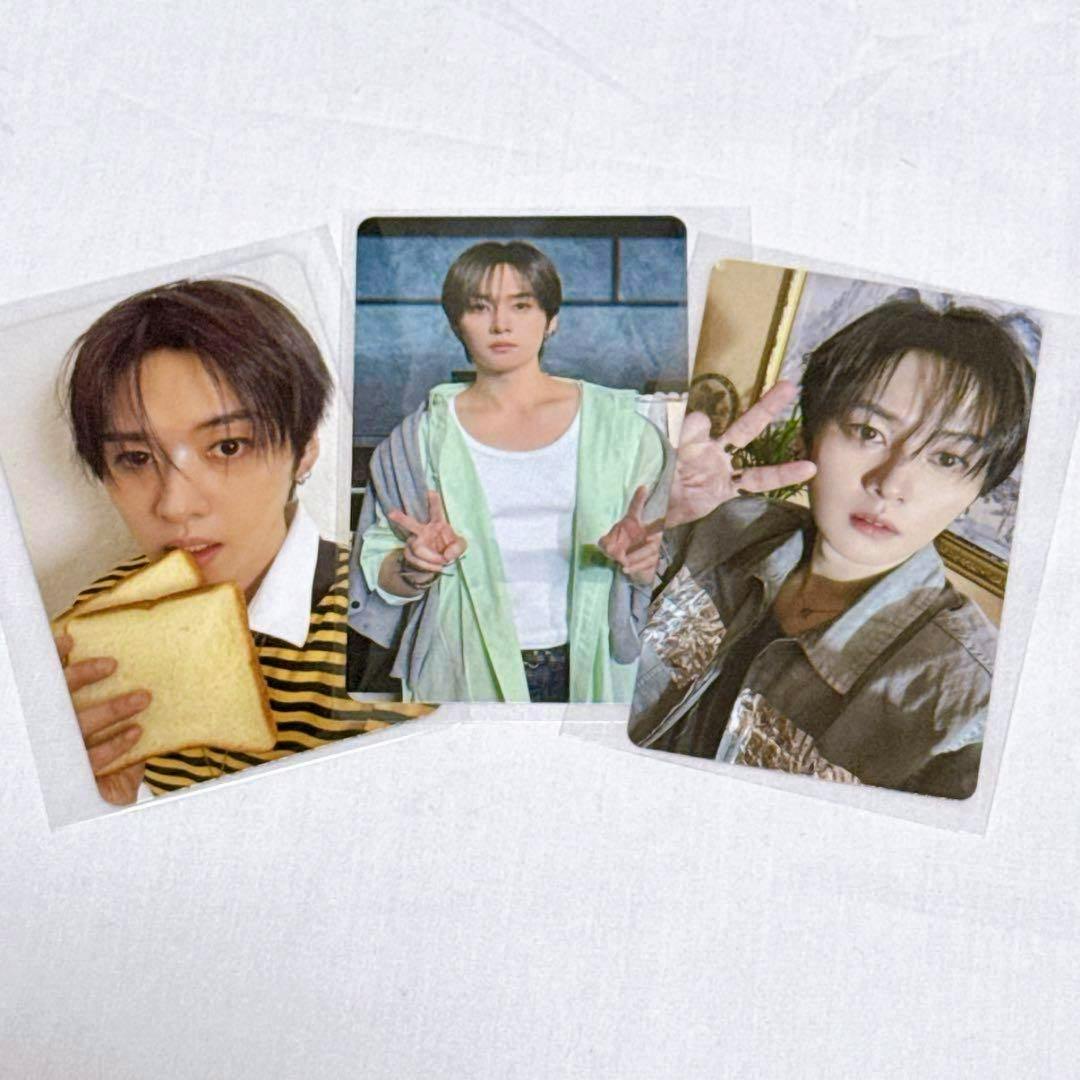 Three photocard trading cards from the listed photocard set arranged on a white background.